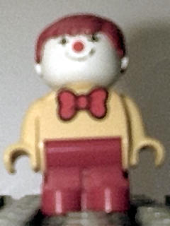 LEGO Duplo Figure, Child Type 1 Boy, Red Legs, Yellow Top With Red Bow Tie, Red Hair (Clown) minifigure