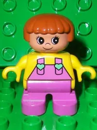 LEGO Duplo Figure, Child Type 2 Girl, Dark Pink Legs, Yellow Top with Dark Pink Overalls and Hearts on Straps minifigure