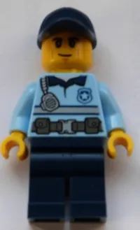 LEGO Police - City Officer Bright Light Blue Shirt with Silver Stripe, Badge and Radio, Dark Blue Legs, Dark Blue Cap, Smirk minifigure